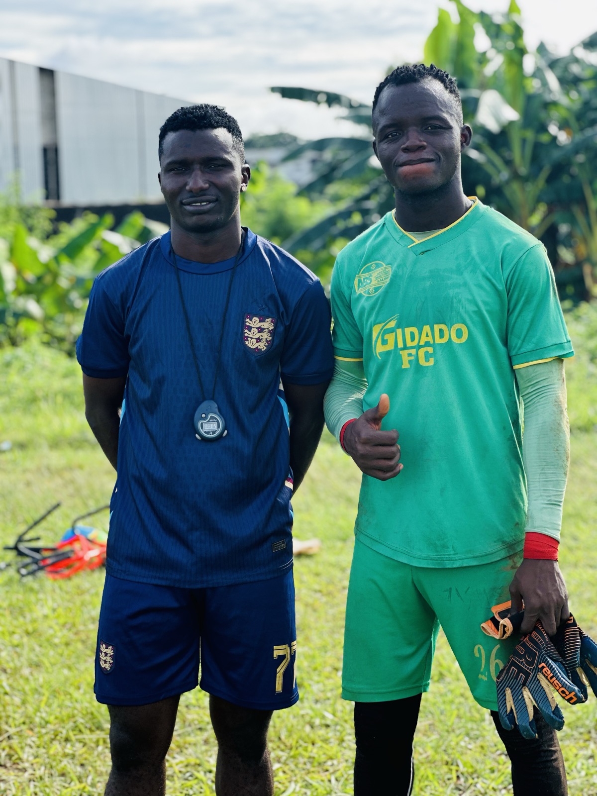 Coach Akindeko with a keeper after training