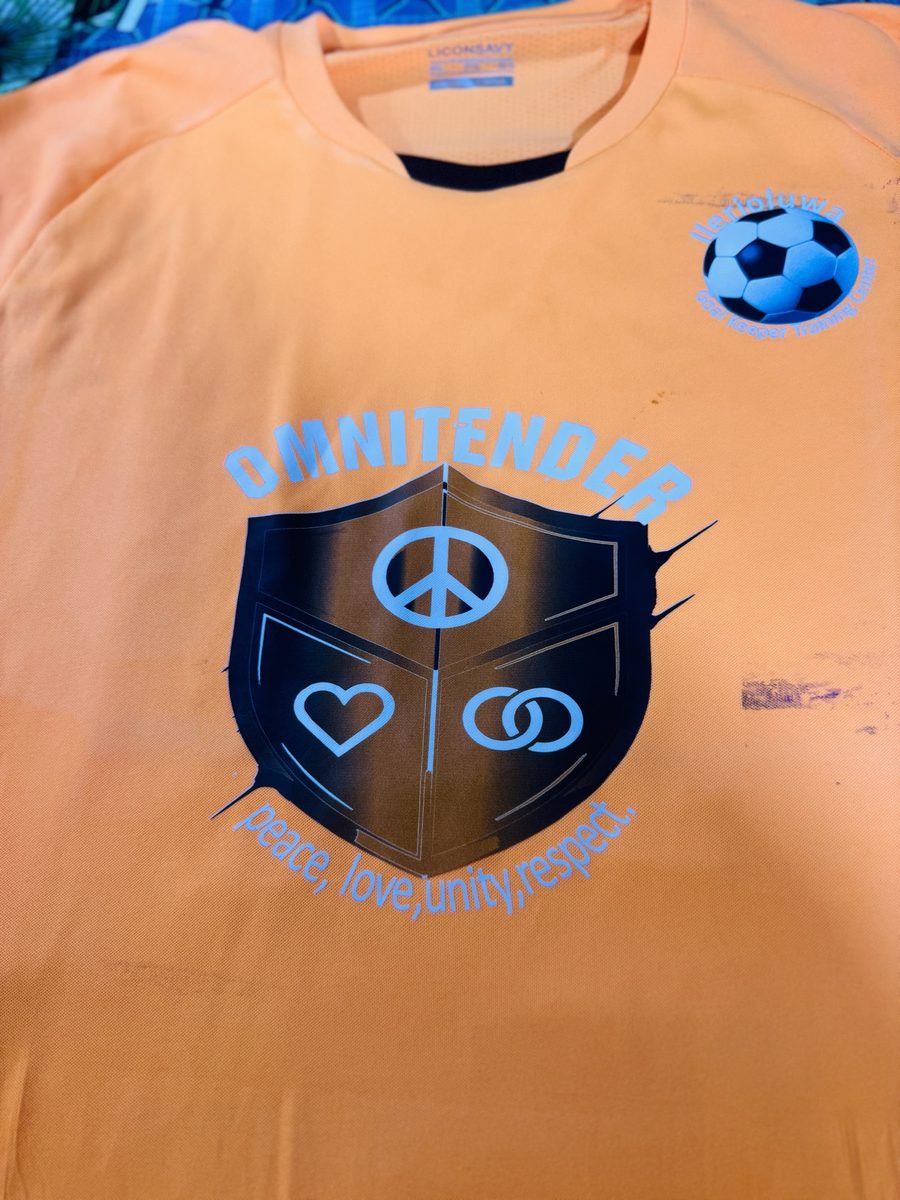 Academy jersey front with peace, love, unity, respect crest